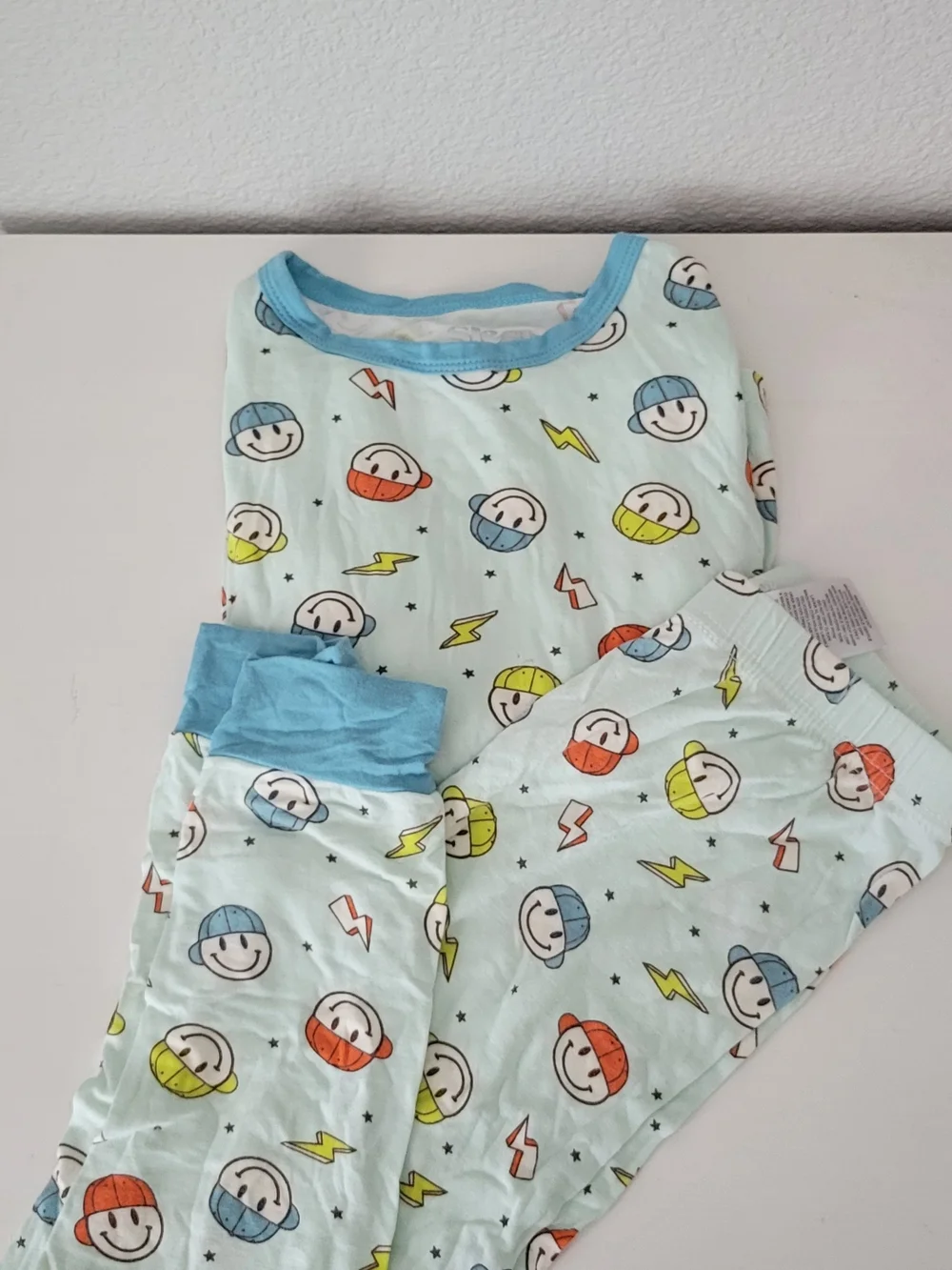 Sleep On It Light Blue Smiley Face Print Footie with Orange and Yellow Accents